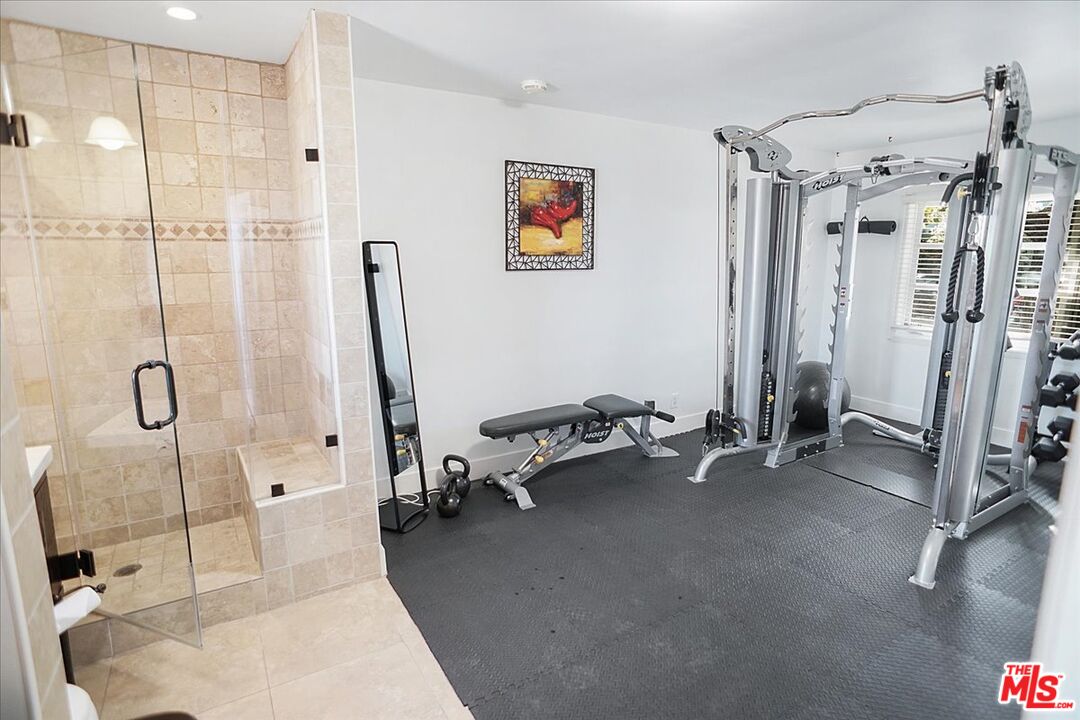 2270 Stradella Road Los Angeles, CA 90077 - Photo 19 of 29 a view of a room with gym equipment