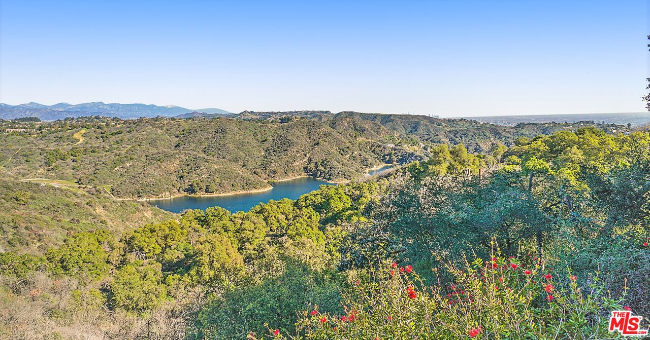 2270 Stradella Road Los Angeles, CA 90077 - Photo 28 of 29 a view of a lake with a mountain in the background