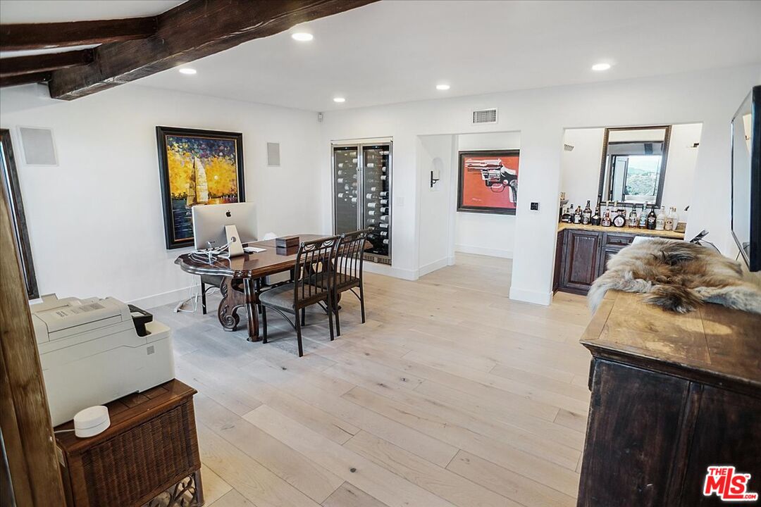2270 Stradella Road Los Angeles, CA 90077 - Photo 9 of 29 a living room with furniture and wooden floor