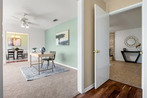 a work room with furniture and wooden floor