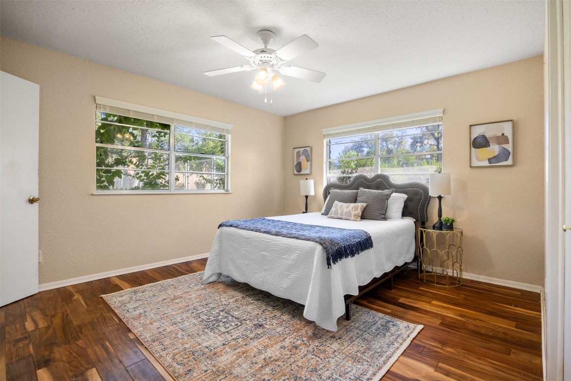 9504 Flintrock Circle Austin, TX 78737 - Photo 17 of 31 a bedroom with a large bed and a window