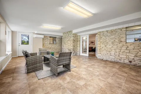 a living room with furniture and windows