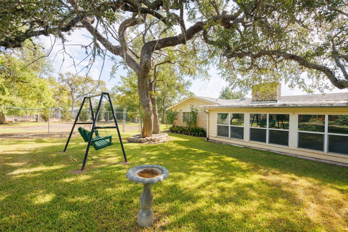 9504 Flintrock Circle Austin, TX 78737 - Photo 29 of 31 a view of a house with pool
