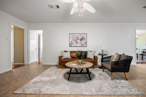 a living room with furniture and a rug
