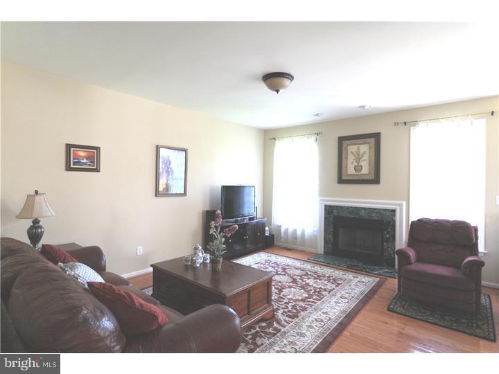 26 Tree Swallow Drive Princeton, NJ 08540 - Photo 11 of 25 a living room with furniture and a fireplace
