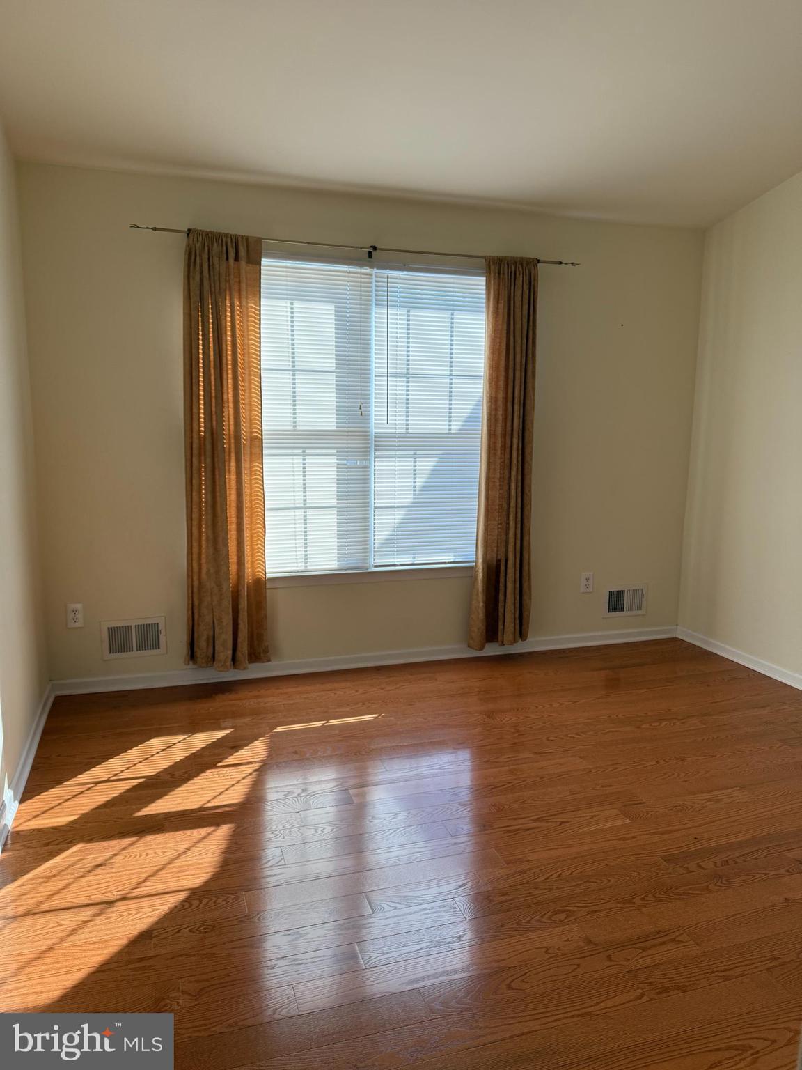 26 Tree Swallow Drive Princeton, NJ 08540 - Photo 17 of 25 a view of an empty room with wooden floor and a window