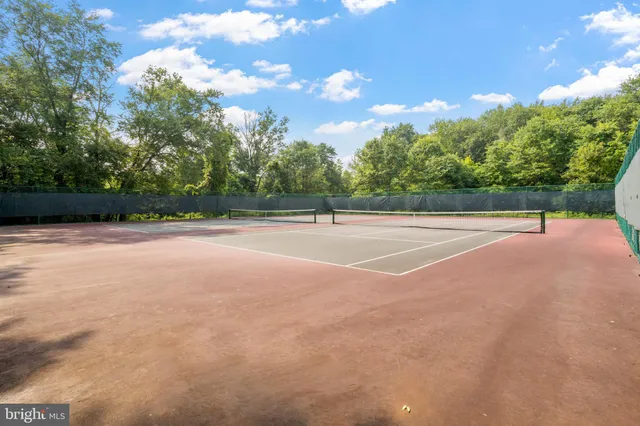 a view of an outdoor space and tennis court