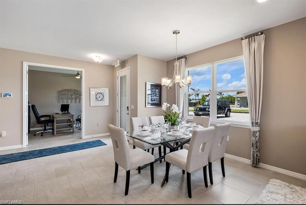 926 Enbrook Loop Naples, FL 34114 - Photo 5 of 15 a view of a dining room with furniture window and outside view