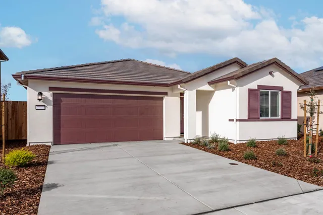 a front view of a house with a garage