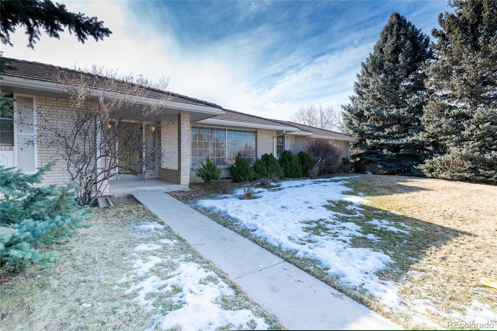 3605 South Oneida Way Denver, CO 80237 - Photo 1 of 24 a view of a house with backyard and sitting area