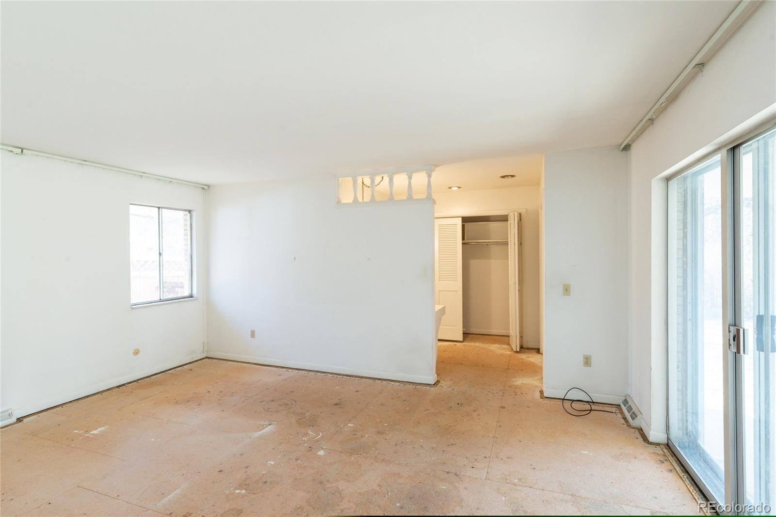 3605 South Oneida Way Denver, CO 80237 - Photo 11 of 24 a view of an empty room with a window