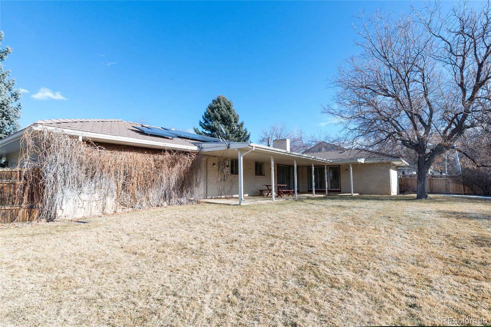 3605 South Oneida Way Denver, CO 80237 - Photo 17 of 24 a front view of a house with a yard
