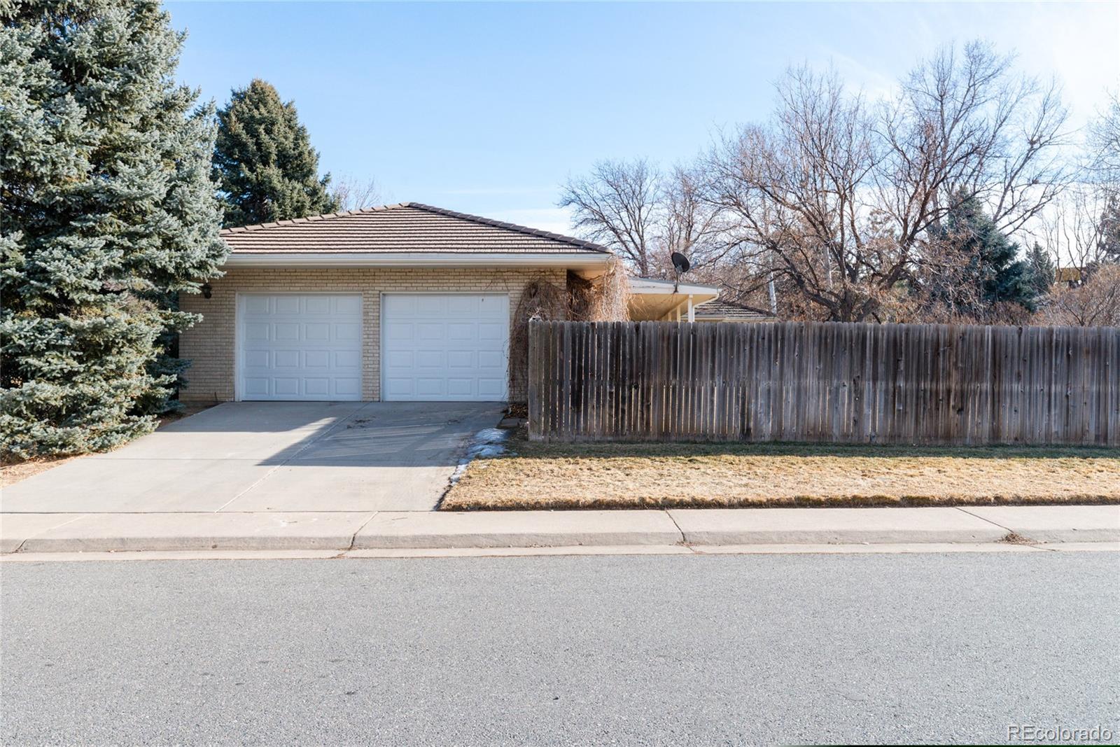 3605 South Oneida Way Denver, CO 80237 - Photo 20 of 24 a front view of a house with a yard