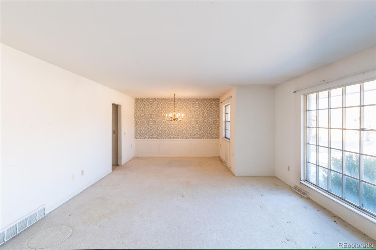 3605 South Oneida Way Denver, CO 80237 - Photo 4 of 24 an empty room with windows