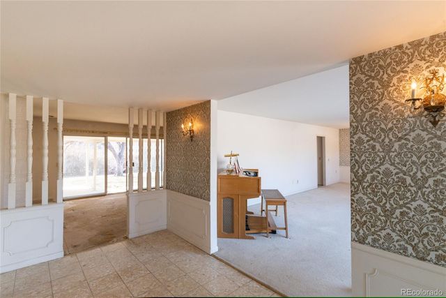 a view of staircase with a rug