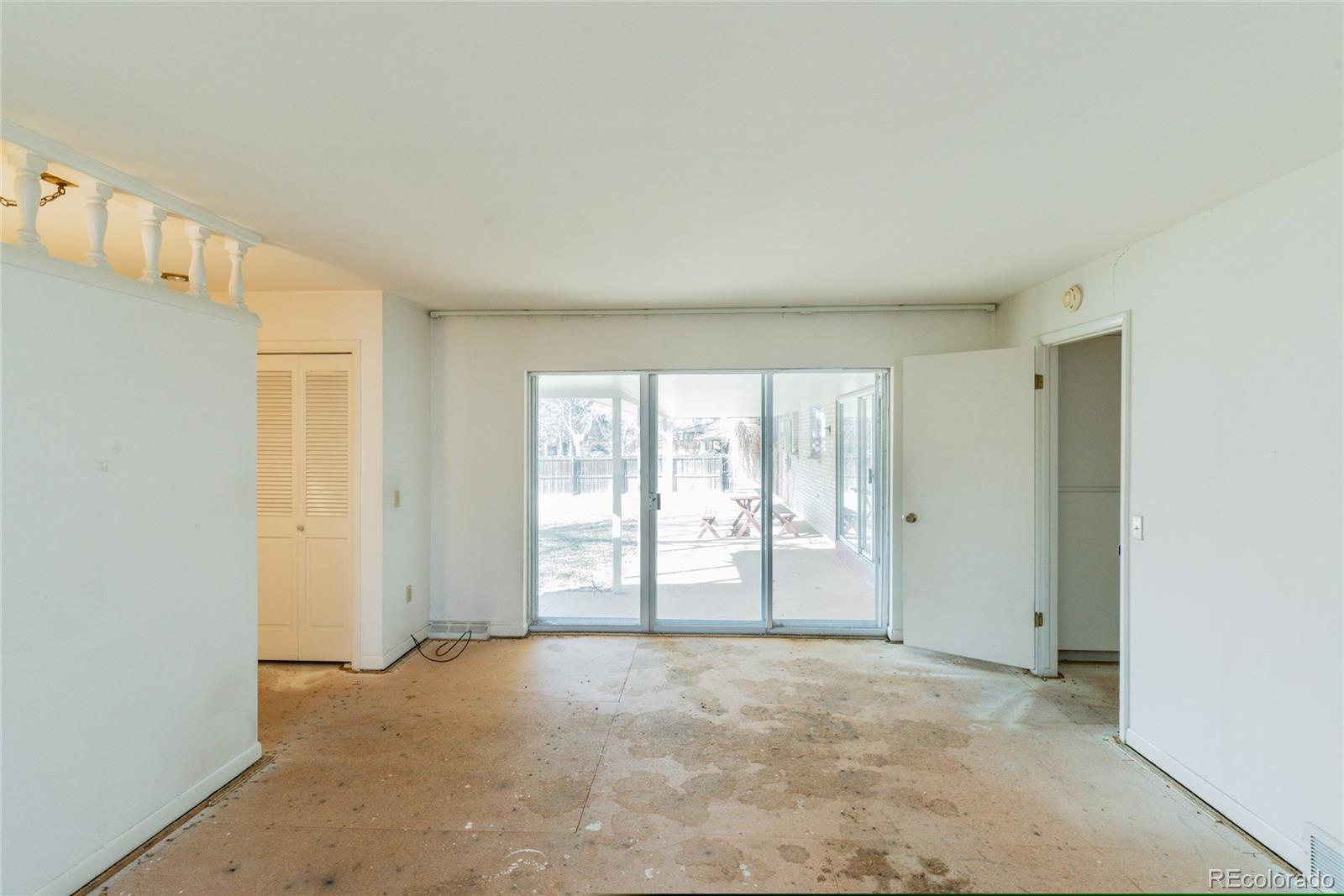 3605 South Oneida Way Denver, CO 80237 - Photo 10 of 24 a view of an empty room with a window