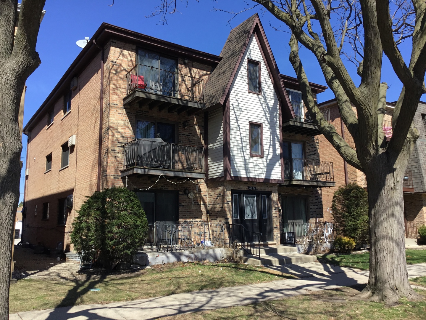 6624 West 64th Place, Unit 3A Chicago, IL 60638 - Photo 1 of 15 a front view of a building with street