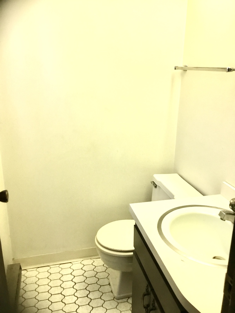 6624 West 64th Place, Unit 3A Chicago, IL 60638 - Photo 12 of 15 a bathroom with a sink and a toilet