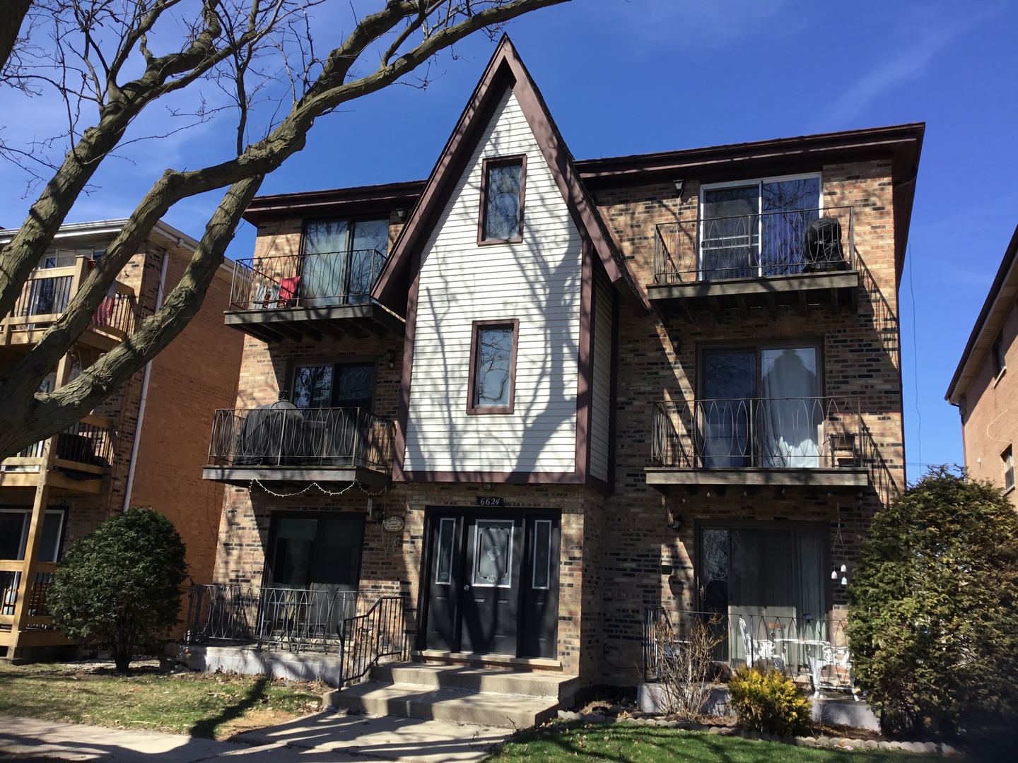 6624 West 64th Place, Unit 3A Chicago, IL 60638 - Photo 2 of 15 a front view of a house with garage
