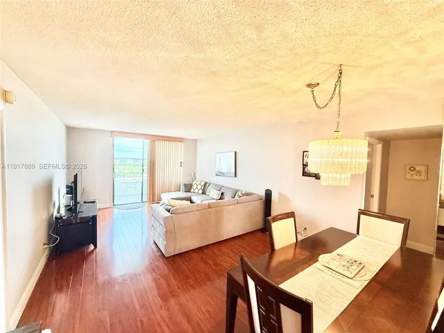 a bedroom with two beds and a large mirror