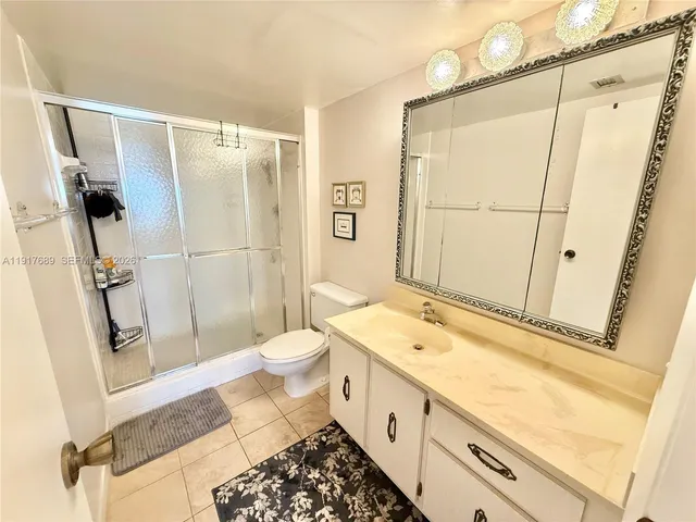 a bed room with a bed and a large window