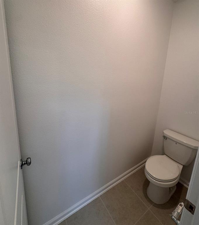 2769 Skyline Loop Kissimmee, FL 34758 - Photo 14 of 17 a white toilet sitting next to a white sink