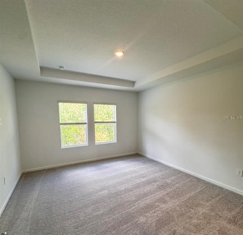 2769 Skyline Loop Kissimmee, FL 34758 - Photo 6 of 17 an empty room with a window