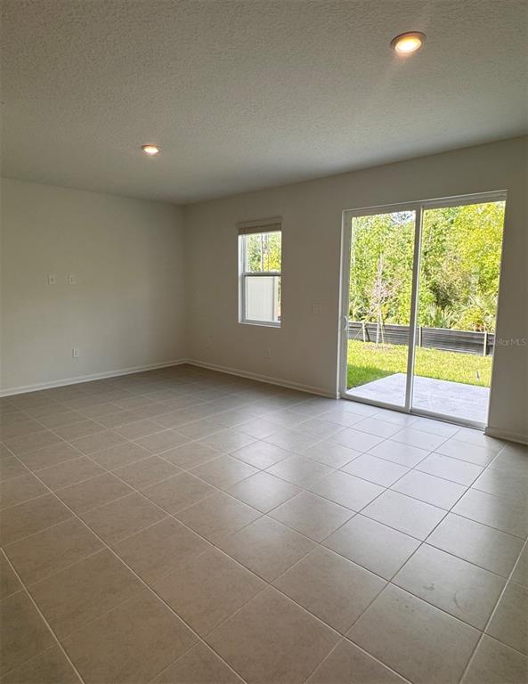 2769 Skyline Loop Kissimmee, FL 34758 - Photo 9 of 17 a view of an empty room with a window
