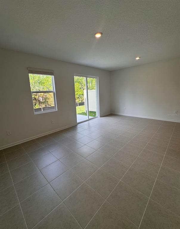 2769 Skyline Loop Kissimmee, FL 34758 - Photo 10 of 17 a view of an empty room with a window