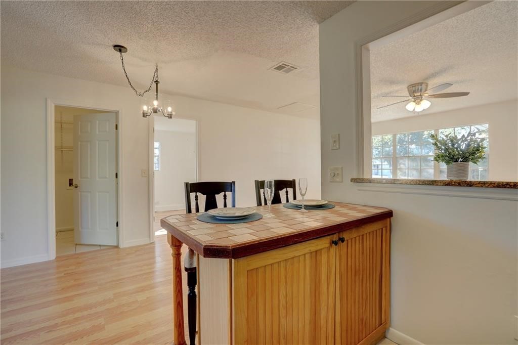 441 Columbus Street Sebastian, FL 32958 - Photo 11 of 35 a kitchen that has a table and chairs in it