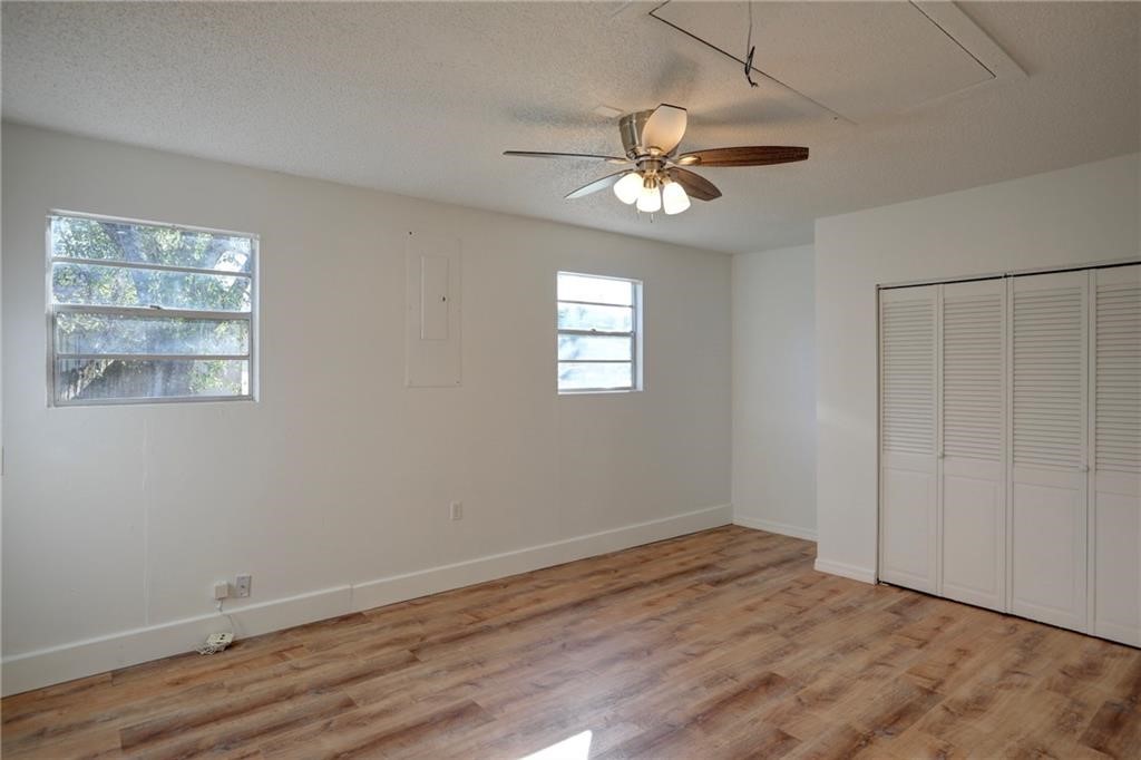 441 Columbus Street Sebastian, FL 32958 - Photo 12 of 35 a view of empty room with wooden floor and fan