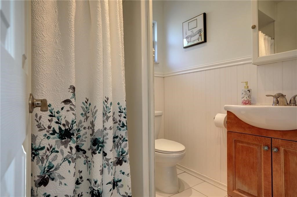 441 Columbus Street Sebastian, FL 32958 - Photo 14 of 35 a bathroom with a toilet a sink and a mirror