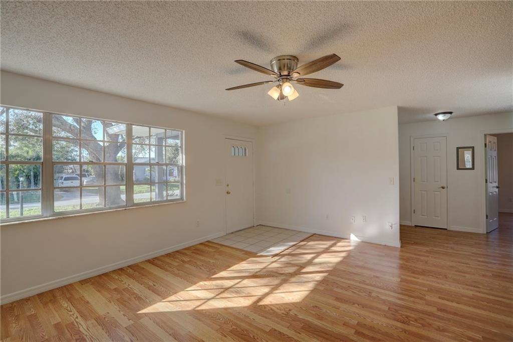441 Columbus Street Sebastian, FL 32958 - Photo 15 of 35 a view of empty room with wooden floor and fan