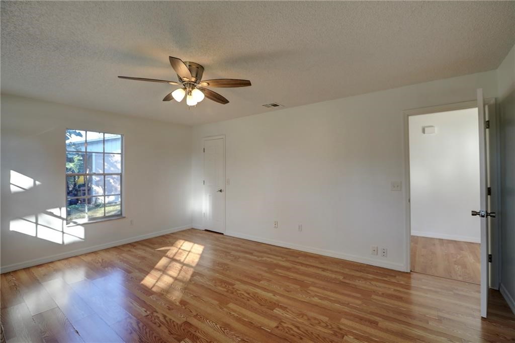 441 Columbus Street Sebastian, FL 32958 - Photo 19 of 35 a view of empty room with wooden floor and fan
