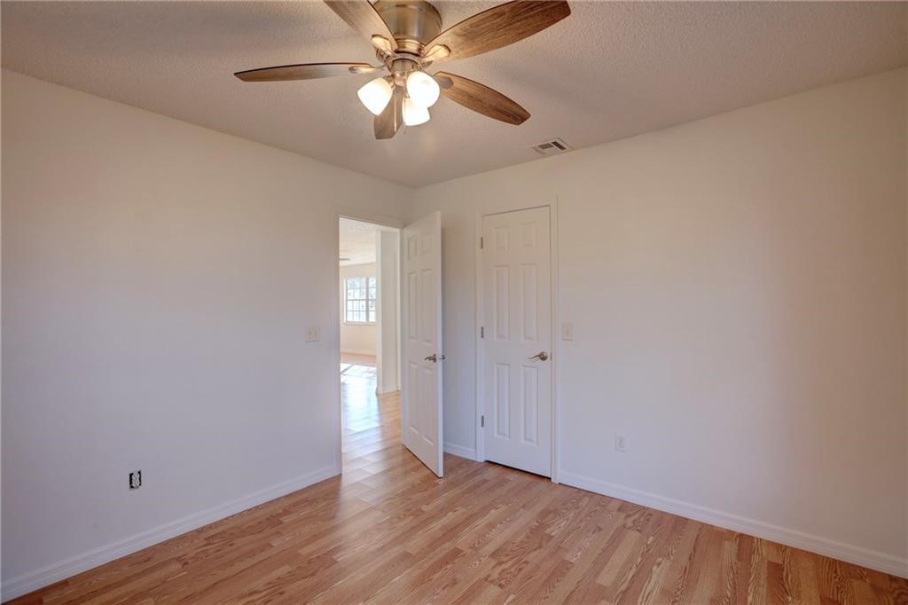 441 Columbus Street Sebastian, FL 32958 - Photo 23 of 35 a view of an empty room with wooden floor