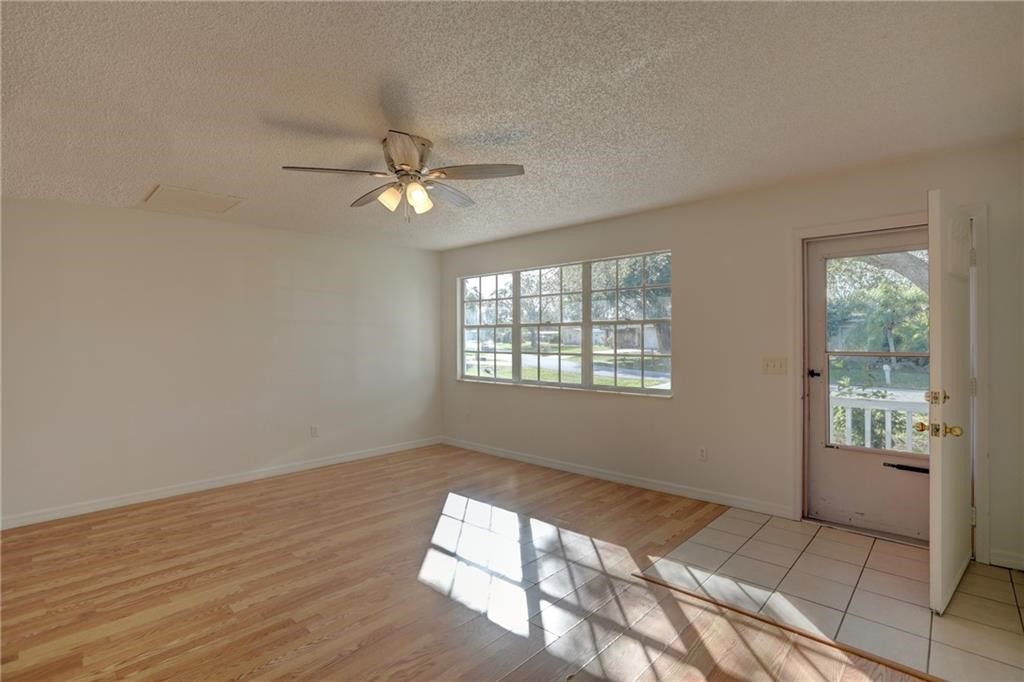 441 Columbus Street Sebastian, FL 32958 - Photo 6 of 35 a view of empty room with wooden floor and fan