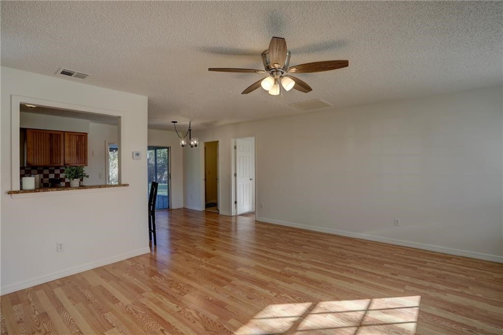 441 Columbus Street Sebastian, FL 32958 - Photo 7 of 35 a view of empty room with wooden floor and fan