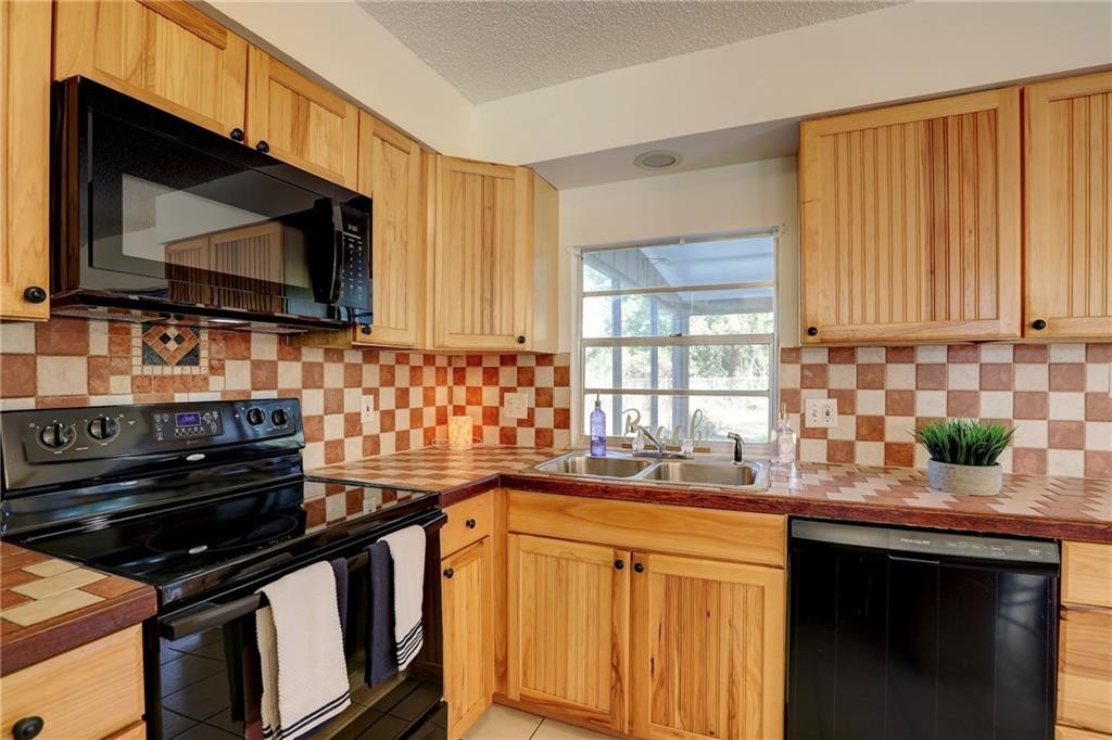 441 Columbus Street Sebastian, FL 32958 - Photo 10 of 35 a kitchen with a stove and a sink