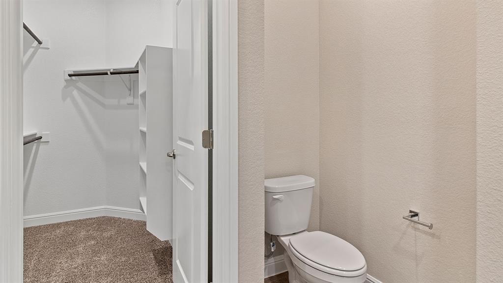 219 Windmill Drive Rhome, TX 76078 - Photo 13 of 29 a white toilet sitting next to a shower