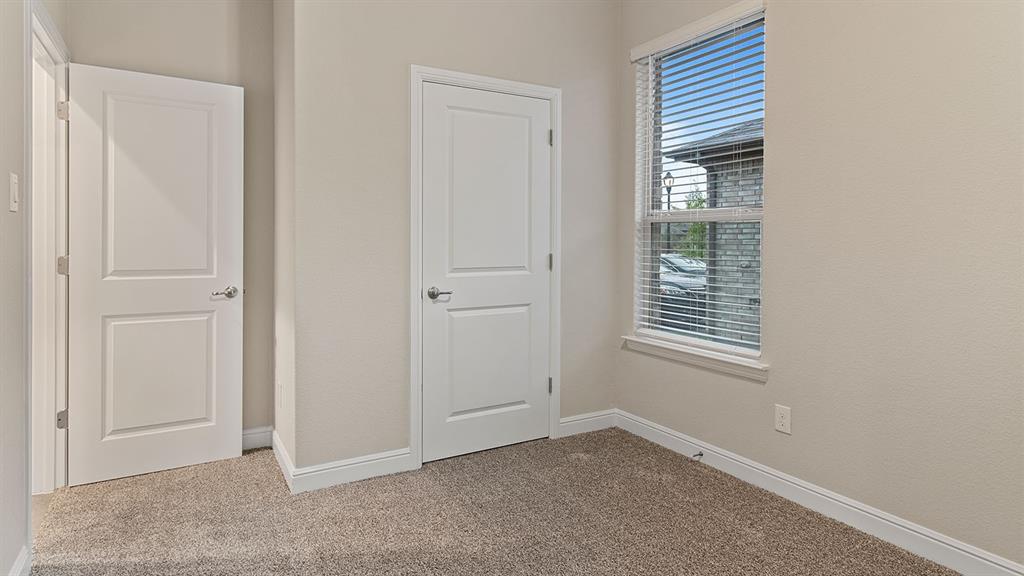 219 Windmill Drive Rhome, TX 76078 - Photo 20 of 29 an empty room with windows