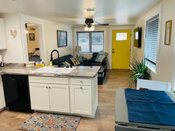 a kitchen with sink and window