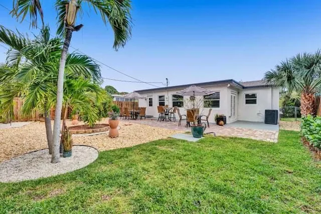 a view of a backyard with a patio