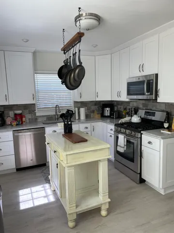 a kitchen with a stove and a microwave