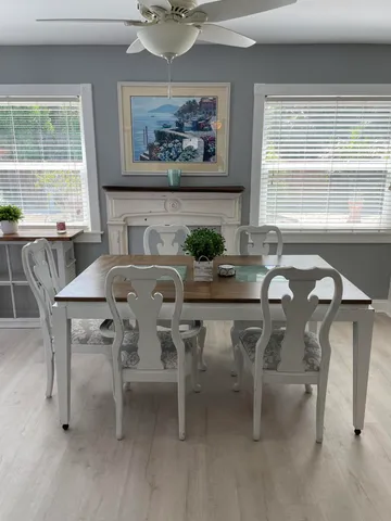 a dining room with furniture and window