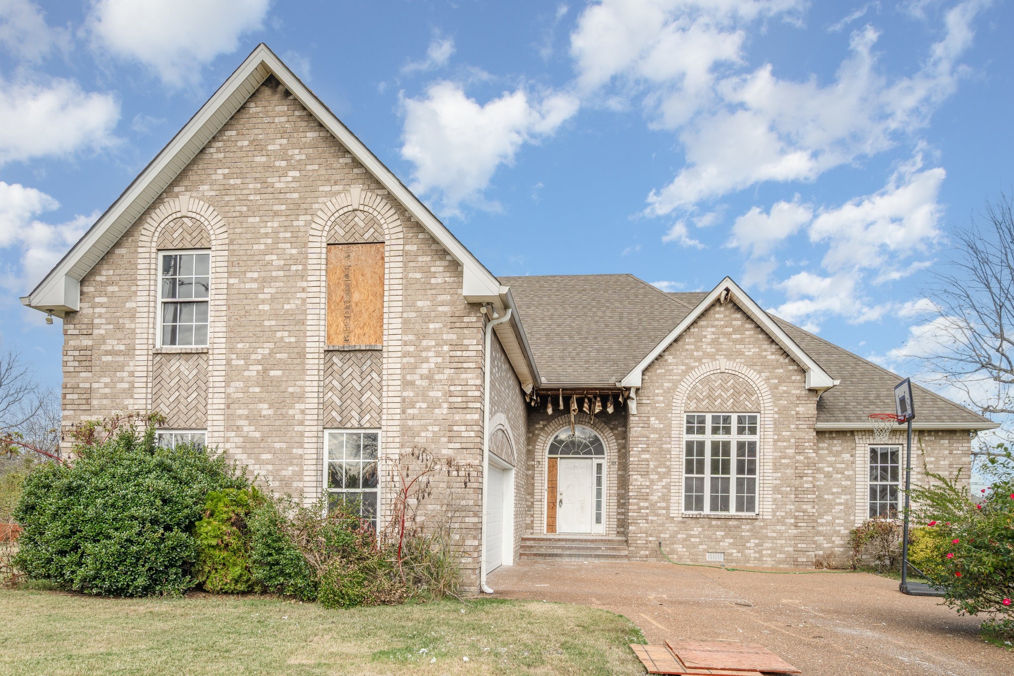 1774 Shagbark Way Gallatin, TN 37066 - Photo 3 of 24 a view of a white house next to a yard