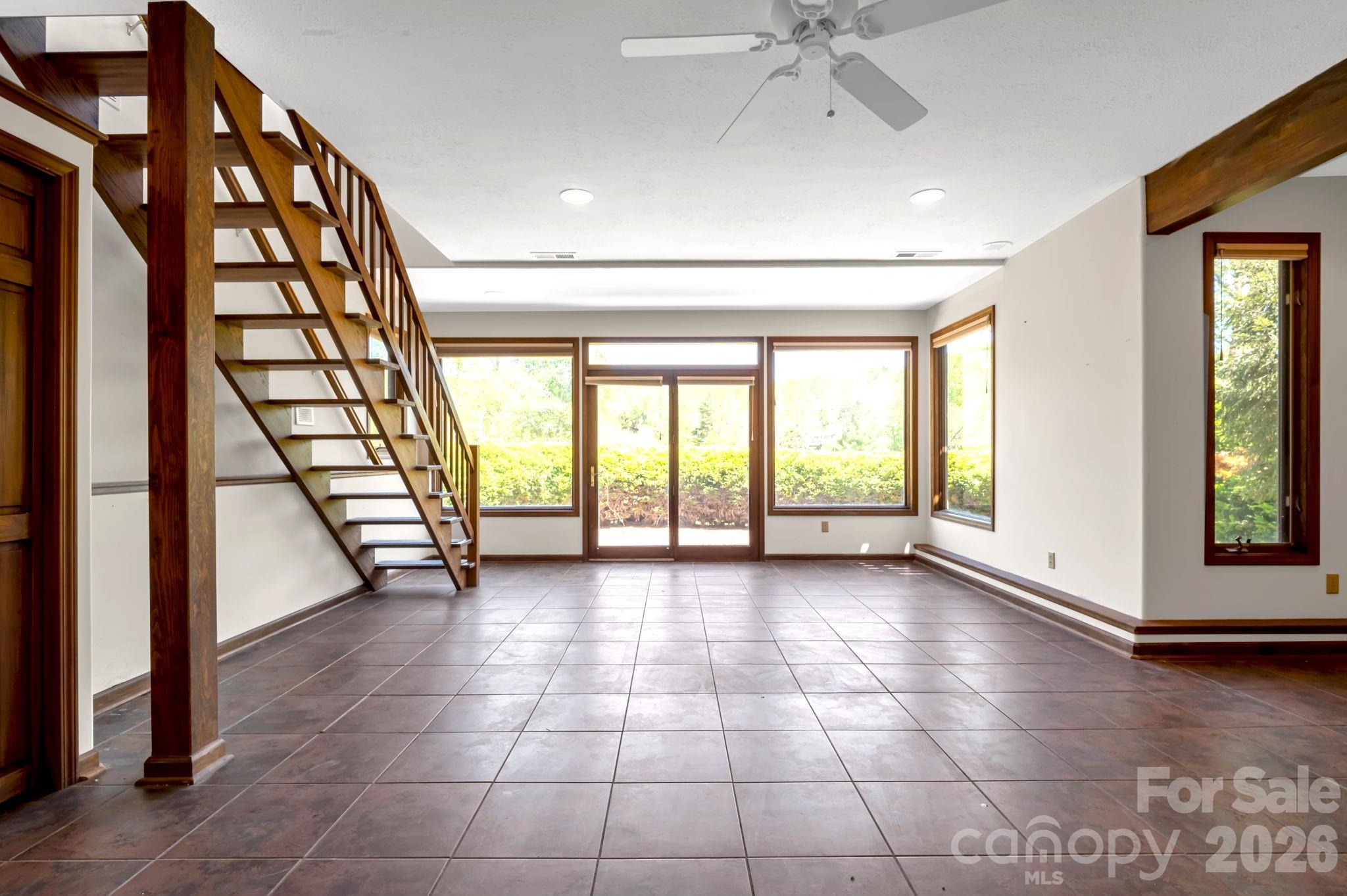 3104 Cove Loop Road Hendersonville, NC 28739 - Photo 29 of 40 a view of an entryway with a floor to ceiling window and stairs