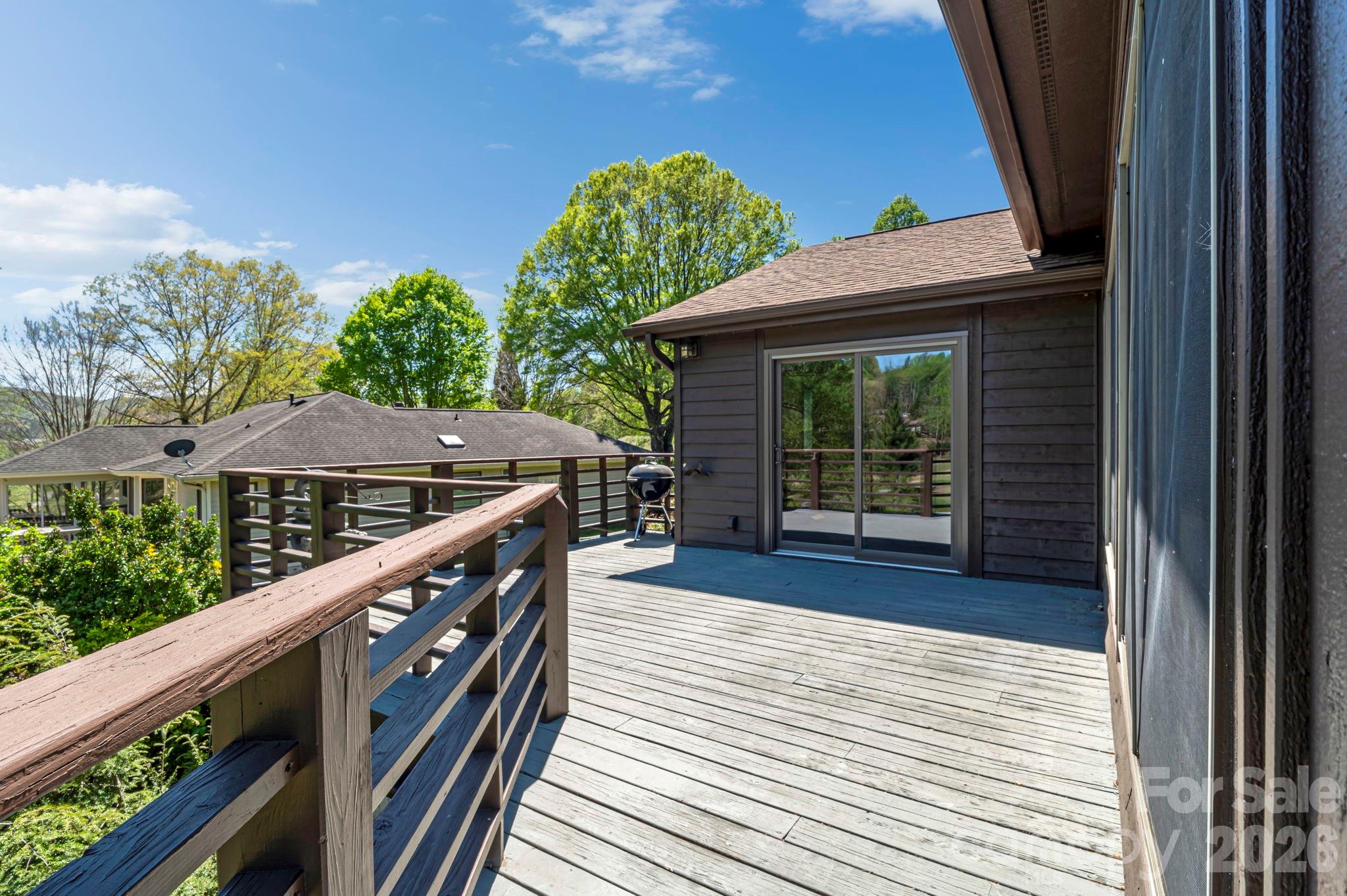 3104 Cove Loop Road Hendersonville, NC 28739 - Photo 39 of 40 a balcony with wooden floor and outdoor space