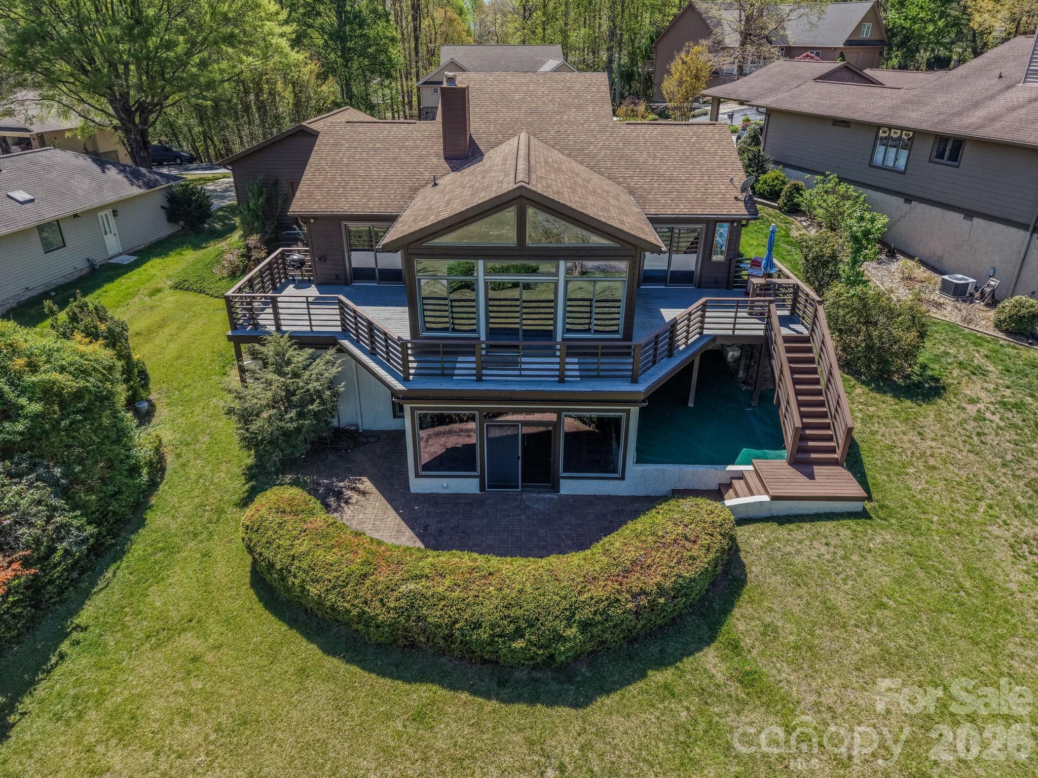 3104 Cove Loop Road Hendersonville, NC 28739 - Photo 5 of 40 a view of a house with pool and garden