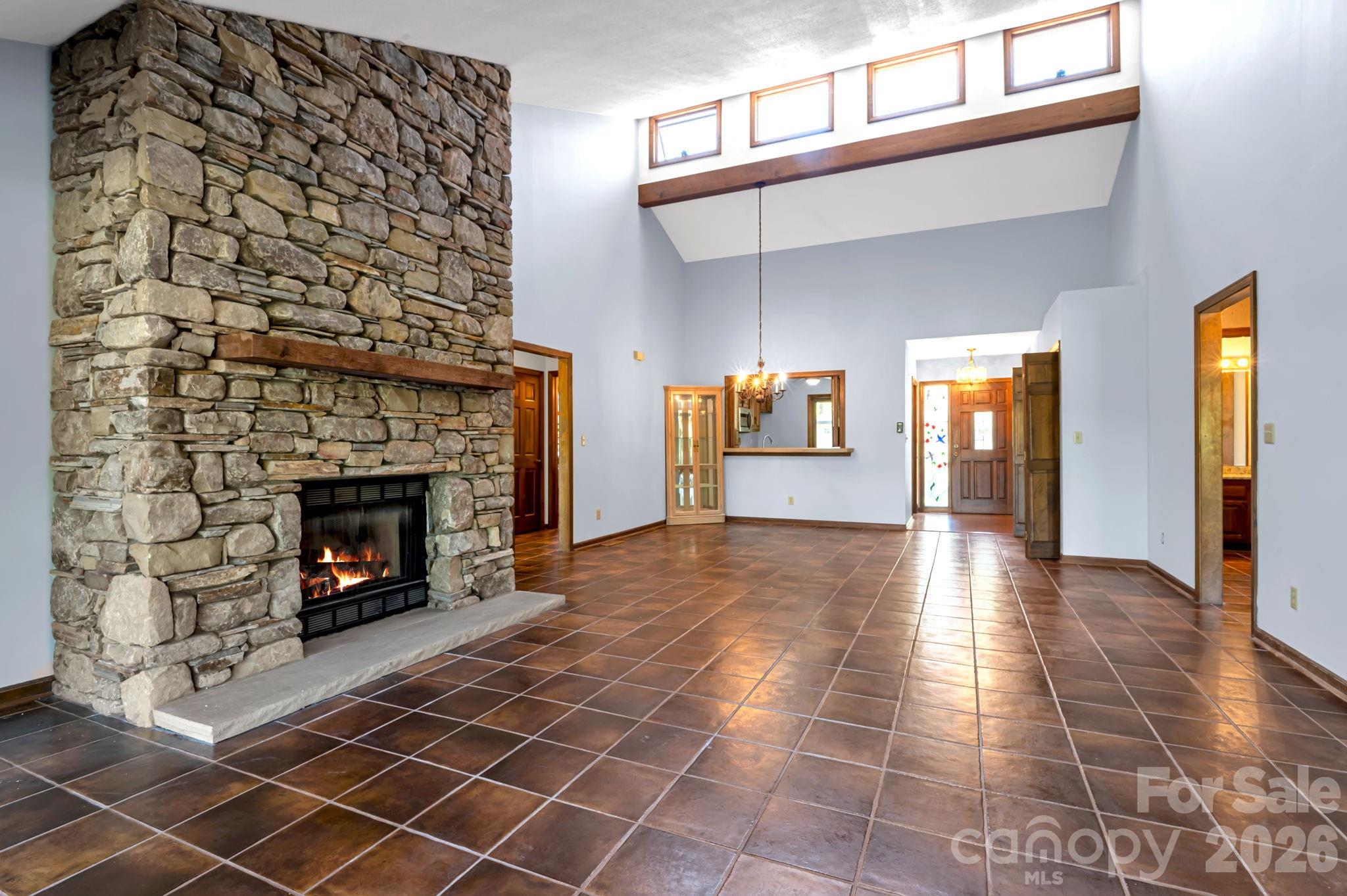 3104 Cove Loop Road Hendersonville, NC 28739 - Photo 10 of 40 a view of a livingroom with fireplace and window