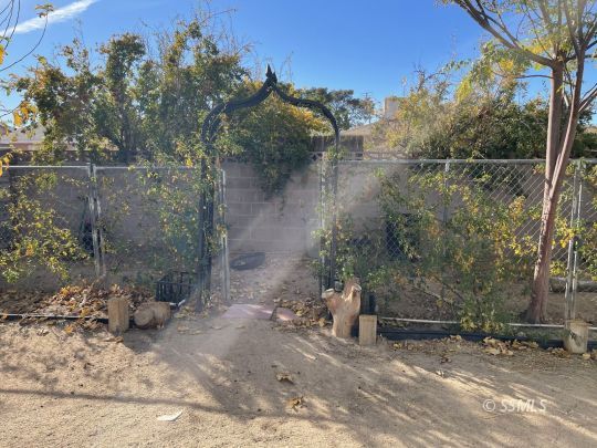 337 Peg Street Ridgecrest, CA 93555 - Photo 30 of 33 a backyard of a house with table and chairs